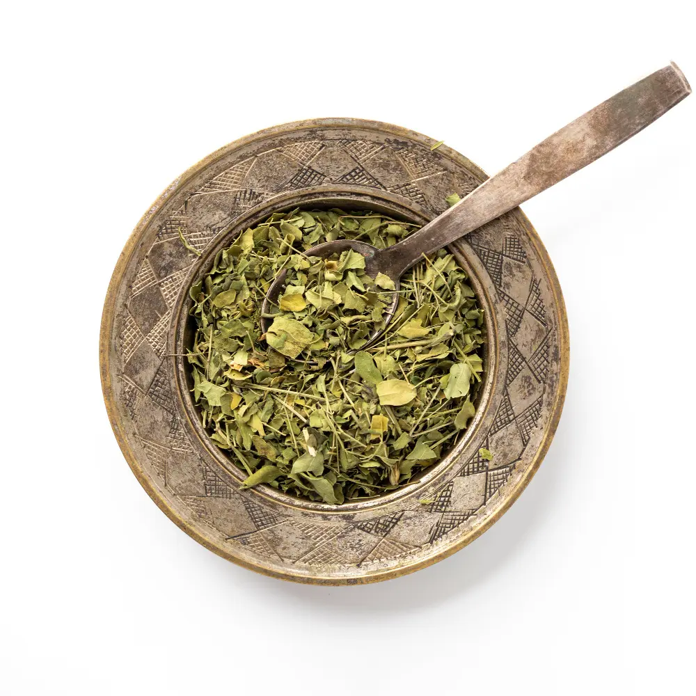 Organic Dried Moringa Leaves in a wooden bowl